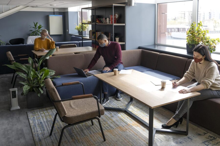 Team collaborating in an office with smart furniture