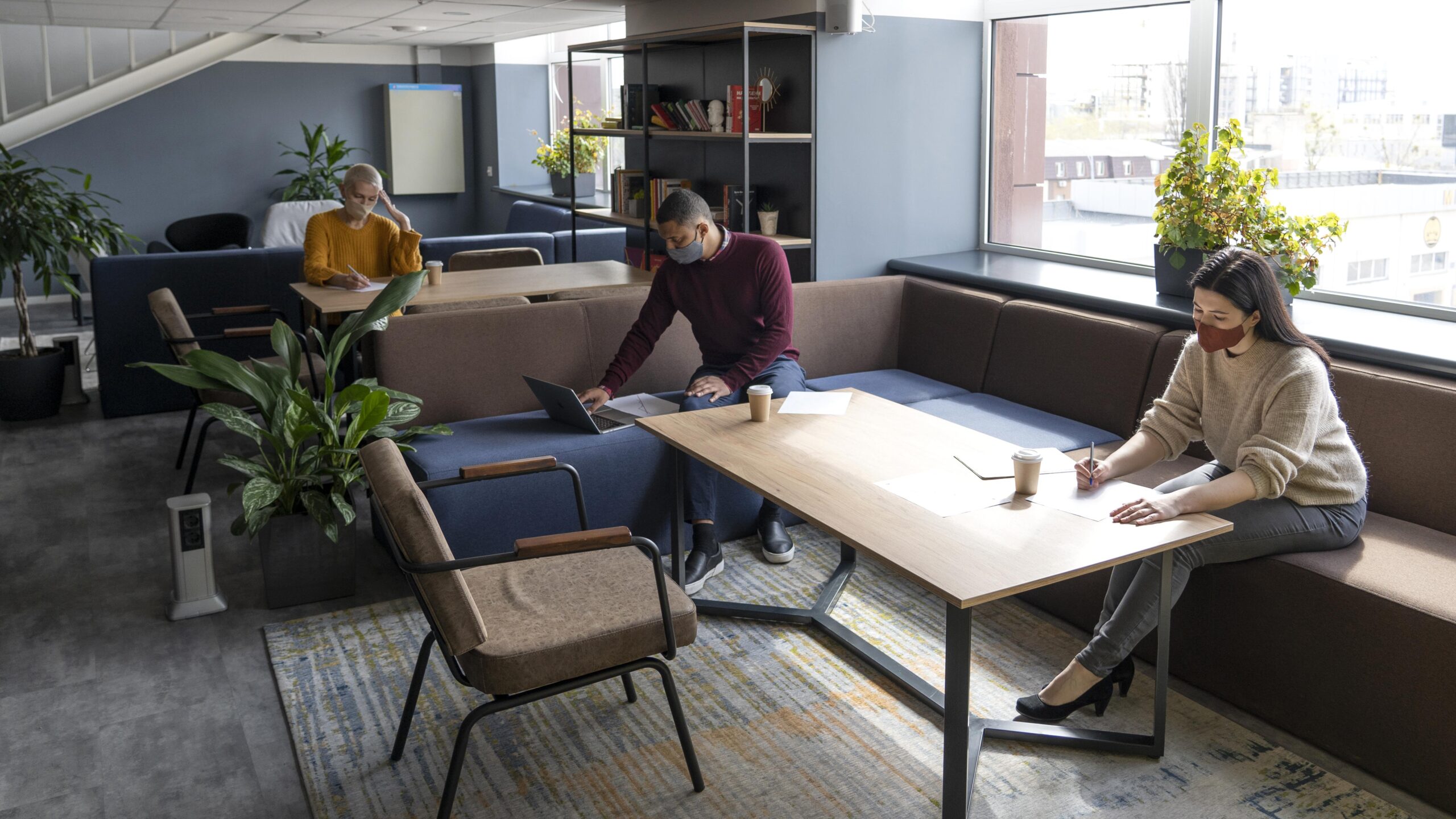 Team collaborating in an office with smart furniture