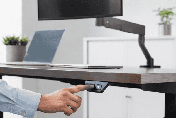 Modern sit-stand workstation with adjustable ergonomic office desk for improved posture and productivity